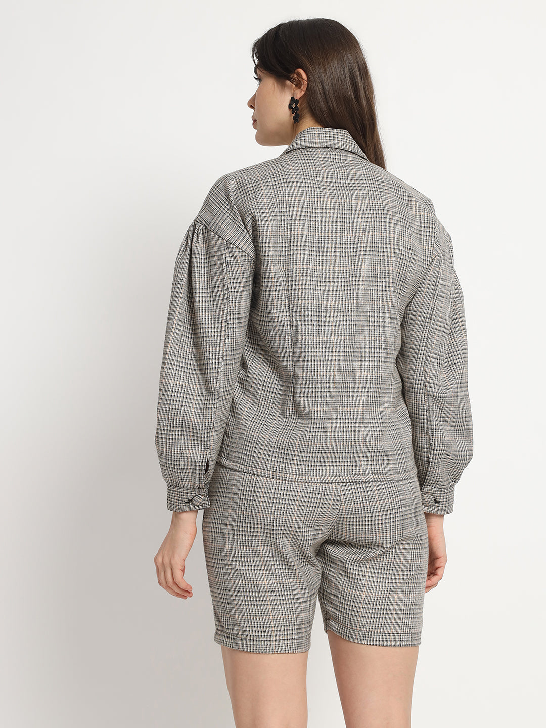 a man standing next to a woman wearing a tie