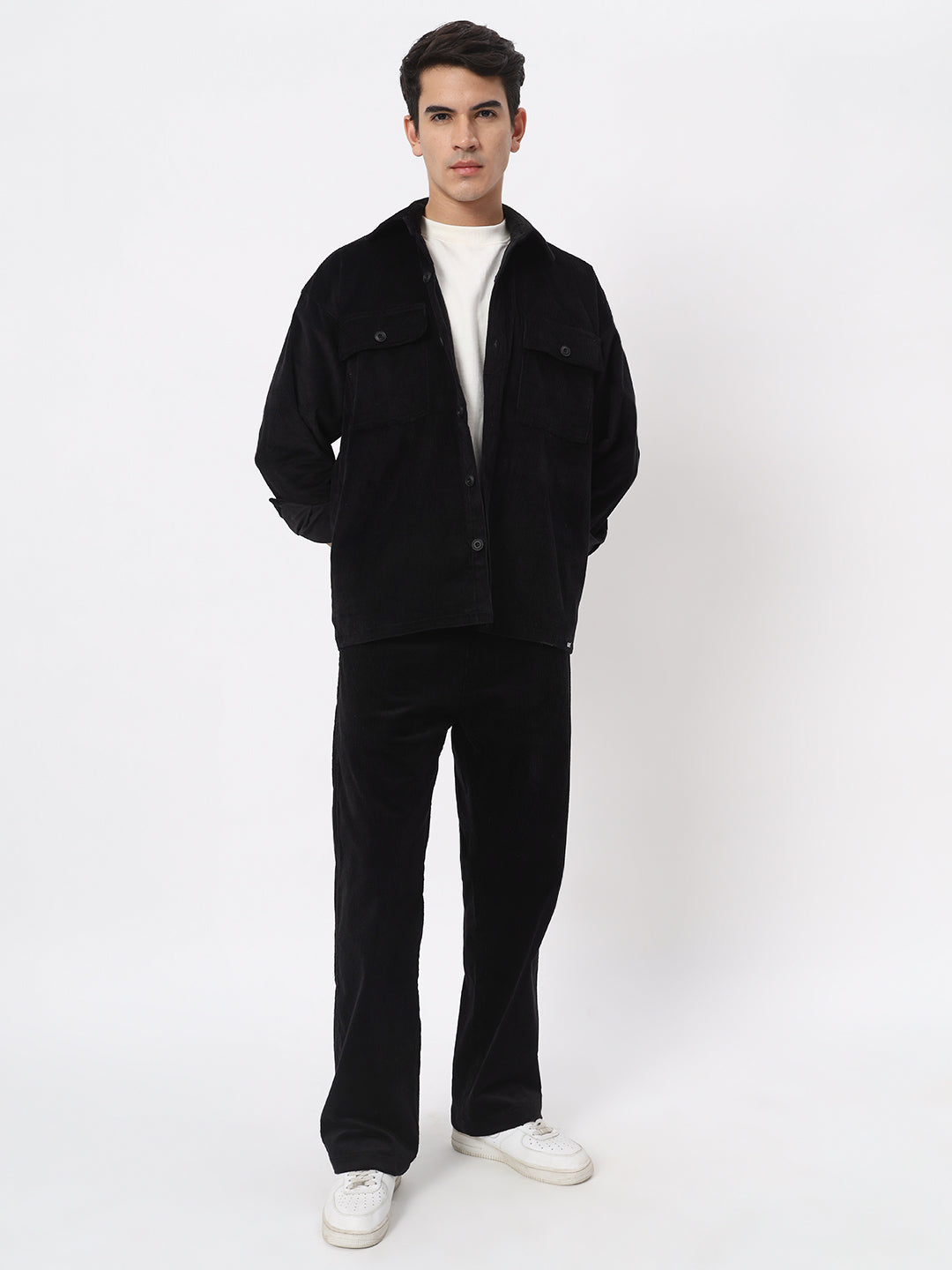 a man standing in a suit and tie