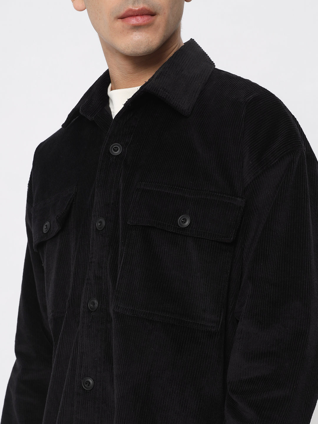 a man wearing a black jacket and a black jacket