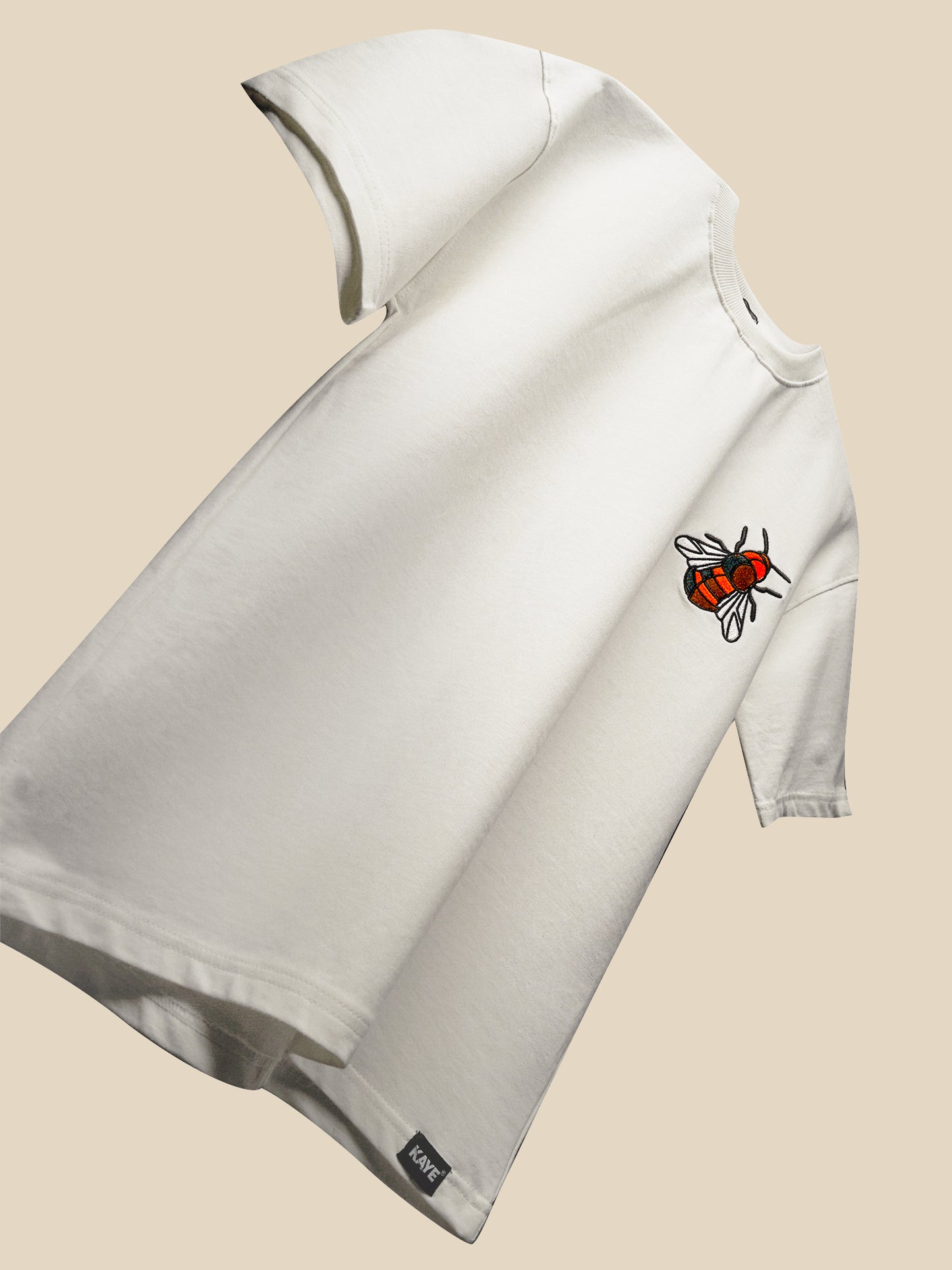 a white blanket with a white ribbon on it
