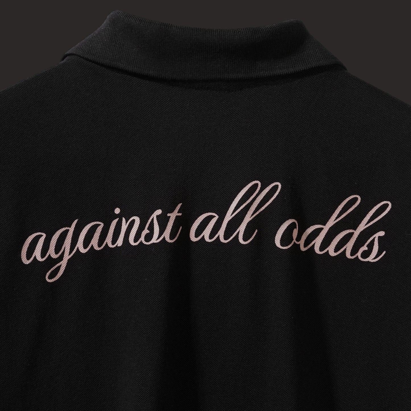 BLACK AGAINST ALL ODDS POLO T-SHIRT